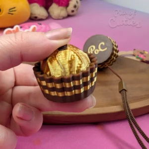Hand pressing a 3D printed fidget clicker inspired by the iconic Ferrero Rocher chocolate